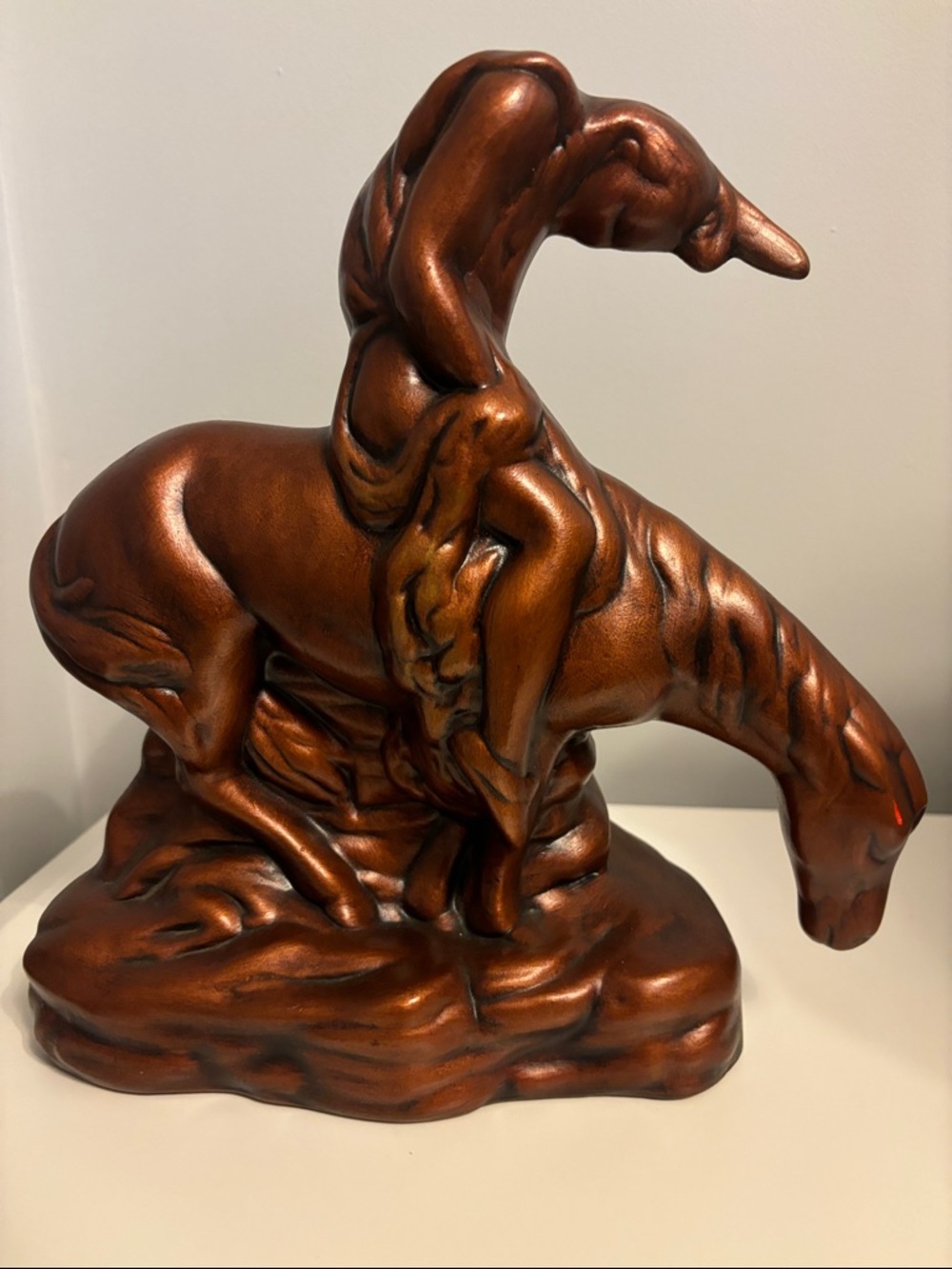 Vintage Native American Weary Warrior Copper-Tone Horse & rider sculpture.